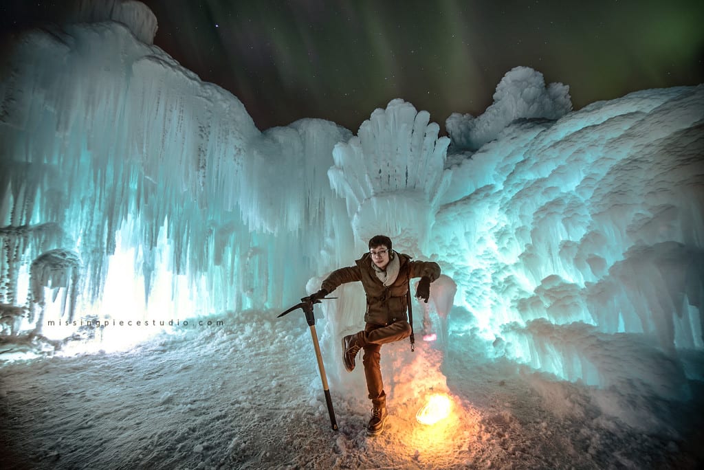 Photographer takes a photo of himself on the ice throne at the Edmonton Ice Castles
