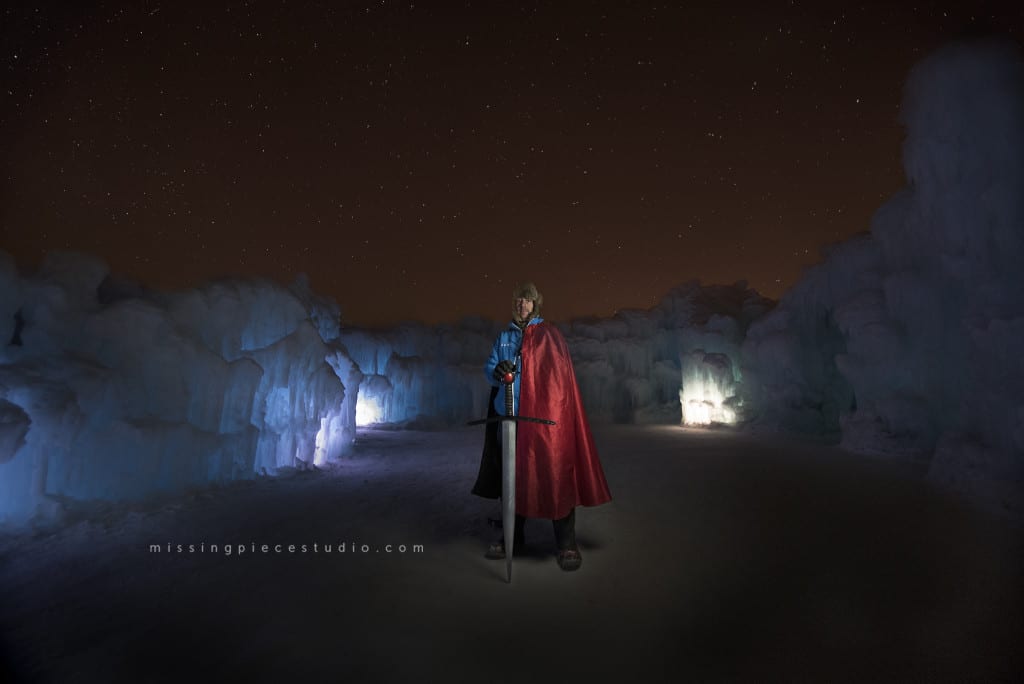 Ice castles staff dresses up as superman at the ice slide
